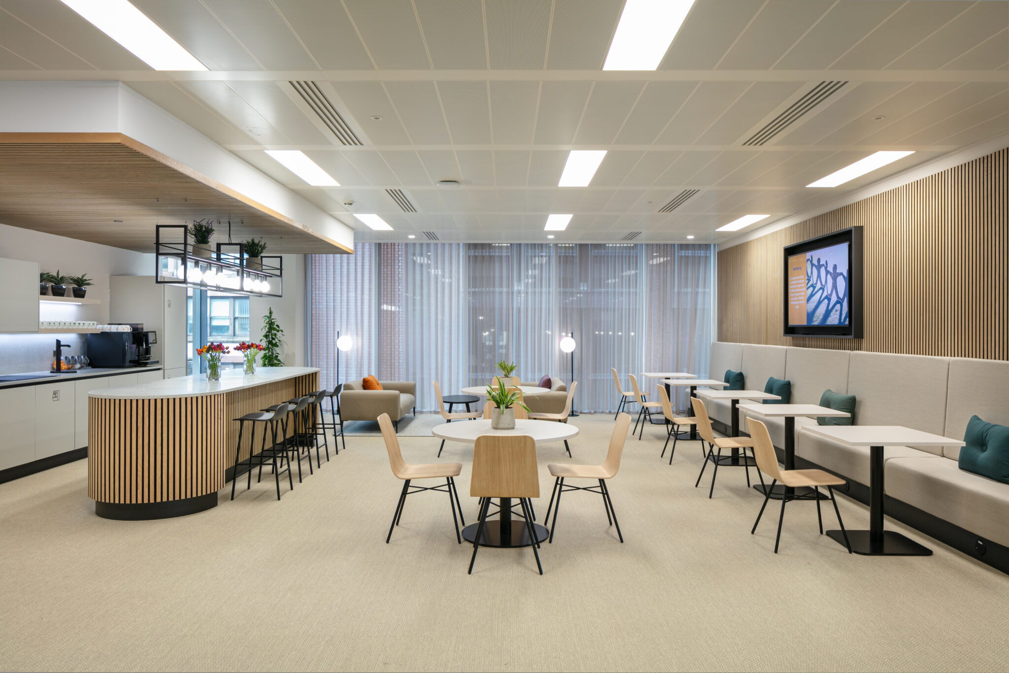 Communal area for a modern office by ADT Workplace