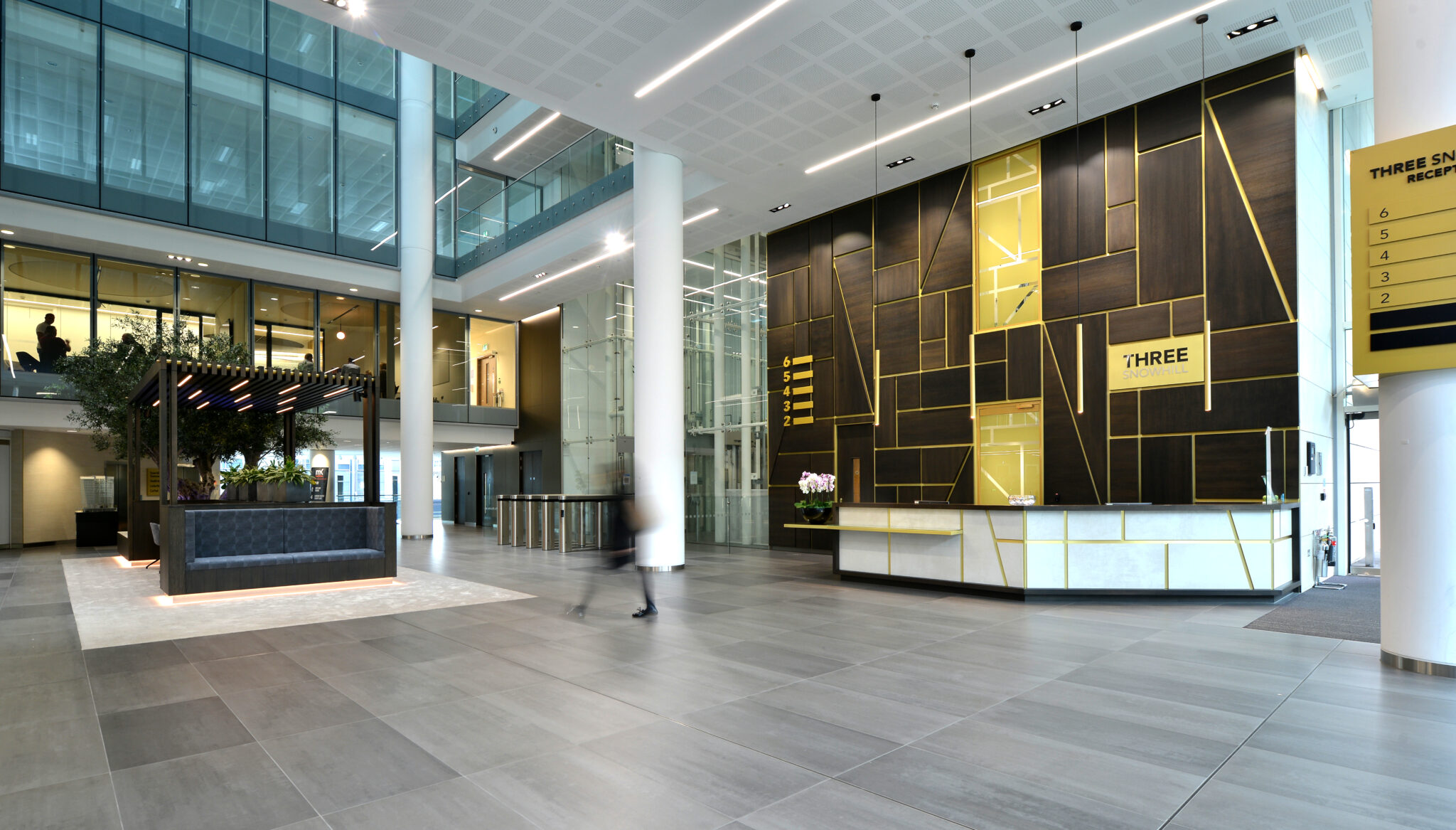 Three Snowhill office reception with modern seating and collaborative workspace